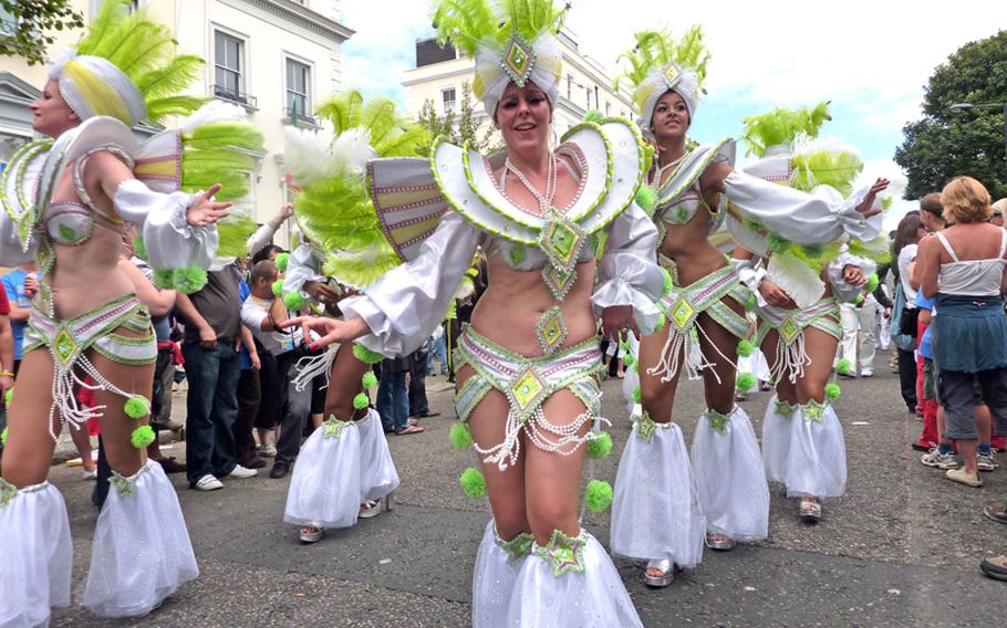 A group dances down the parade route at London's 2009 Notting Hill Carnival. 