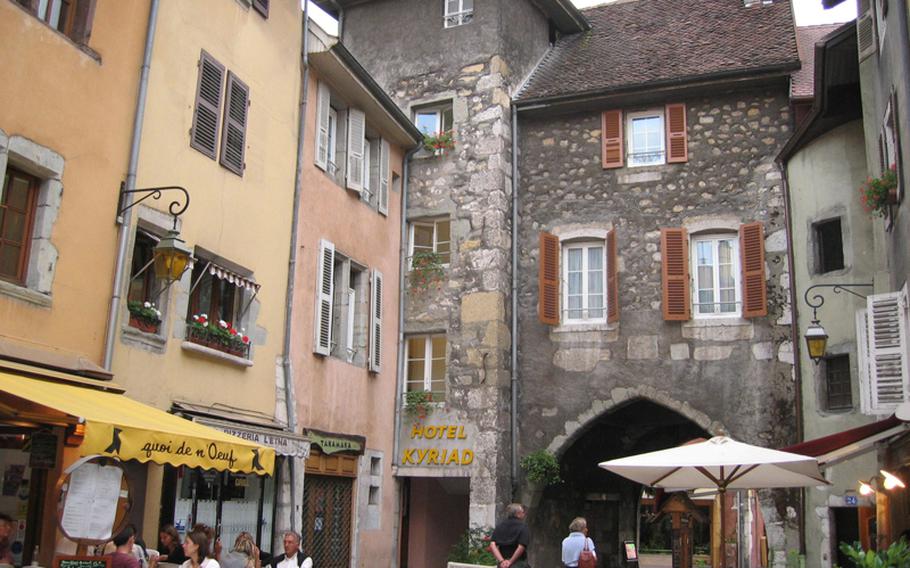 While Annecy has its busy walkways along the canal and the bustling lake area, it also has quiet get-away nooks and crannies to explore. This little corner had a small but wonderful restaurant surrounded by high buildings of various colors with shutter-decorated windows.