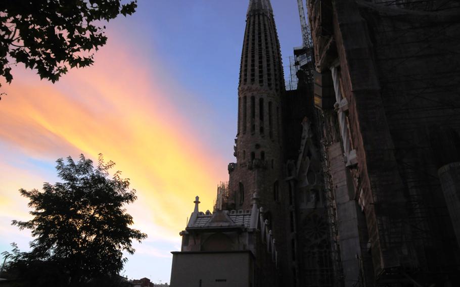 Sun sets on architect Antoni Gaudi's still unfinished La Sagrada Familia in Barcelona.