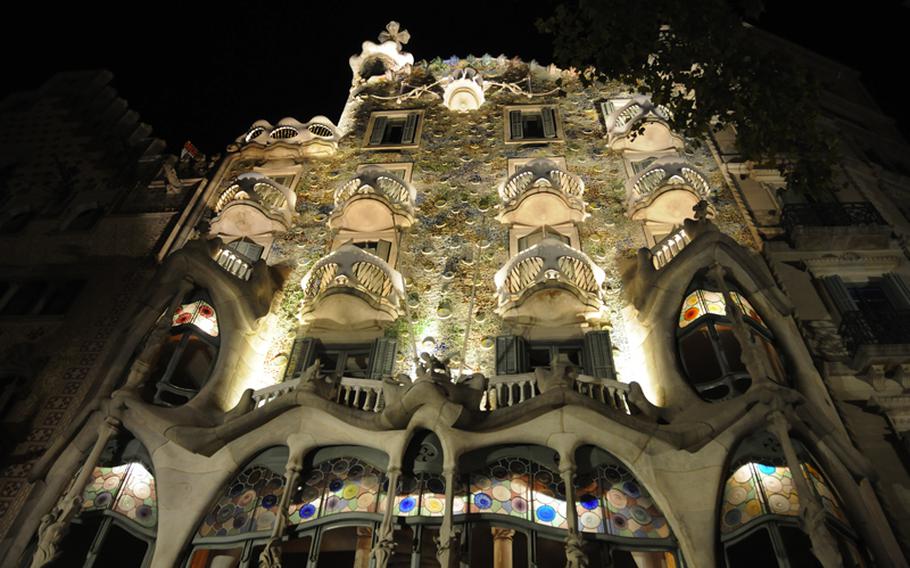 Well-placed lighting illuminate Barcelona's famed Batllo House, designed by the eccentric Spanish architect Antoni Gaudi. In 1904, building owner Josep Batllo i Casanovas commissioned Gaudi to refurbish an existing building. The home-turned-tourist attraction boasts one of the world's most impressive facades, and inside is full of curves,  from the walls to banisters, staircases and ceiling arches. The tiled roof is associated with a scaled dragon's back.