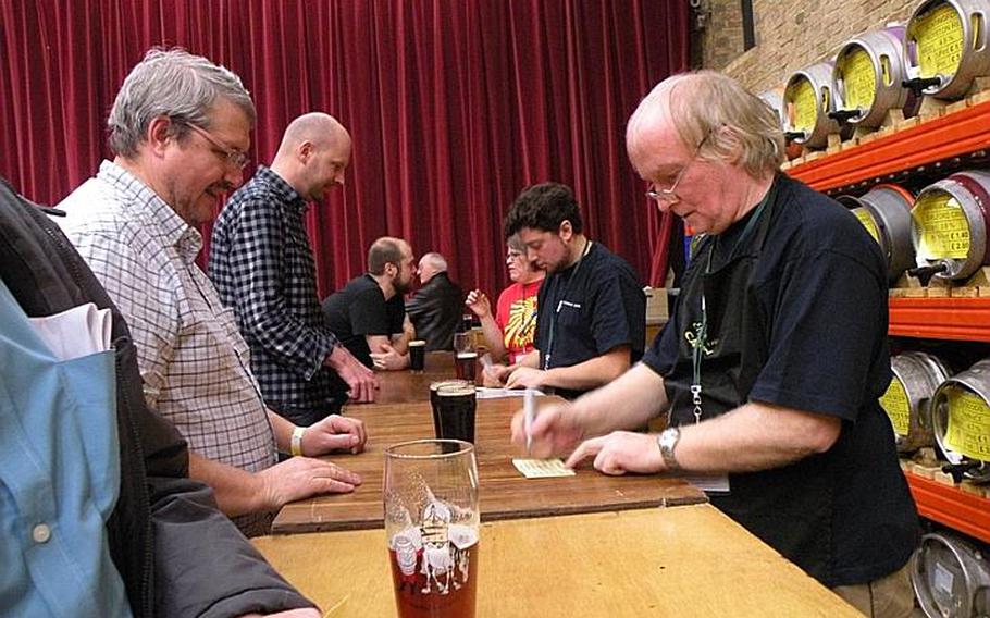 Patrons at the second annual Elysian Winter Beer Festival in Ely, England, sample and discuss some of the local beers featured at the two-day fest.