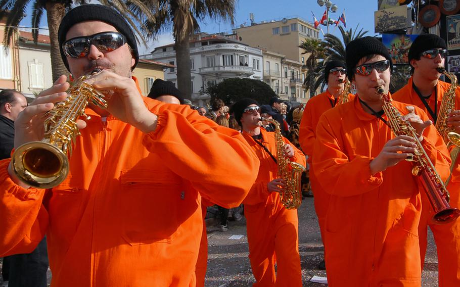 A band entertains spectators before the start of the Viareggio, Italy, carnival parade.