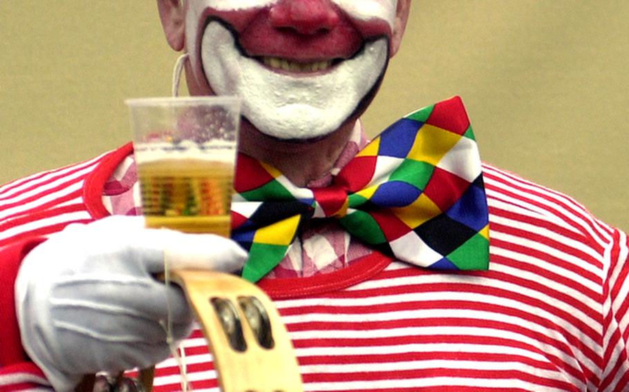 A clown enjoys the carnival season in Cologne, Germany.