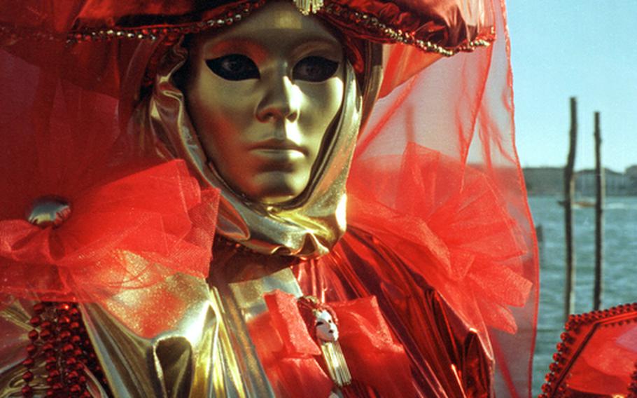 One of the many ornate costumed characters of the Venice carnival.