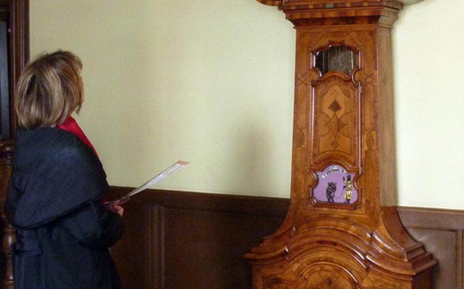 A tourist views one of the main attractions at the Goethe-Haus, an astronomical clock built in 1746. It shows the date, time, the phase of the moon and the sun in the signs of the zodiac. The little bear in the lower window falls over when it is time to wind up the clock.