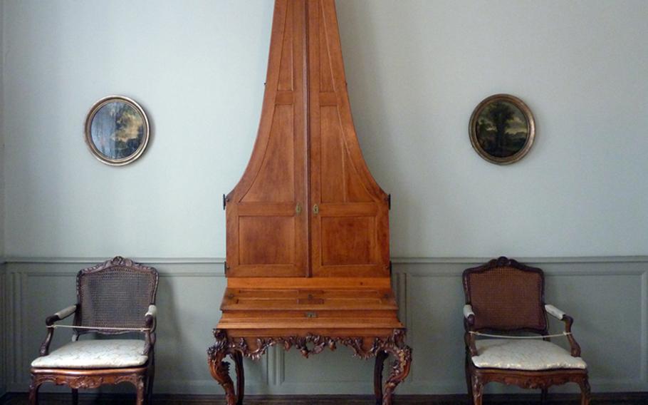 This rare pianoforte, known as a pyramid piano, stands in the music room.