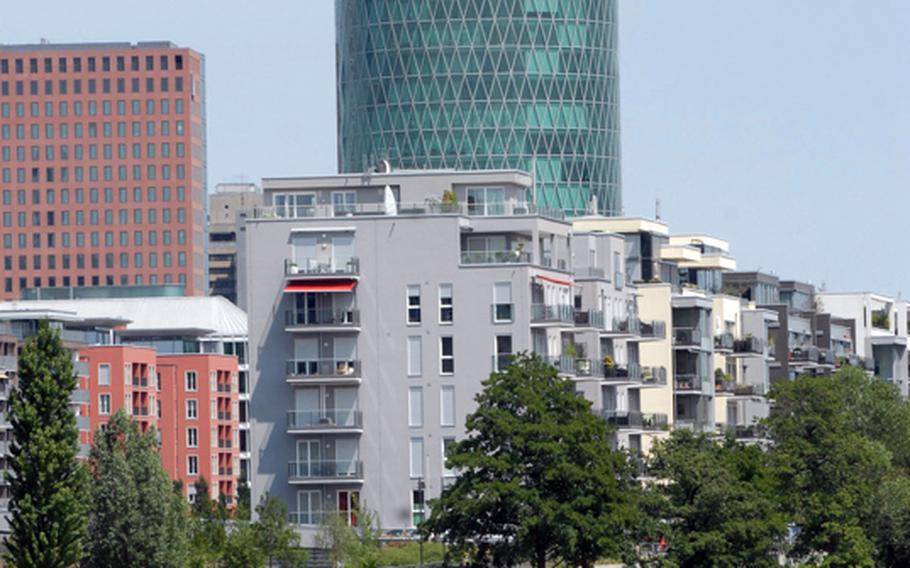 A building dubbed by residents as "the world&#39;s tallest apple-wine glass" towers above the banks of the Main River in Frankfurt.  Apple wine is a drink with roots in the region and is a popular summertime choice for city residents.