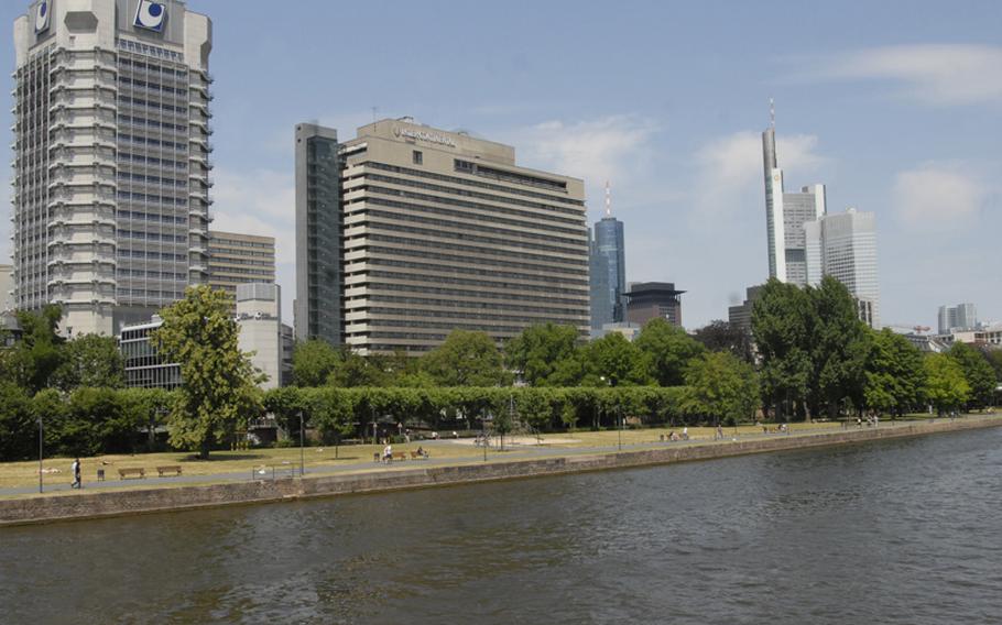 The Nautilus cruises past Frankfurt&#39;s financial district.  Many upscale parks, apartments and local boat clubs line the banks of the Main River in this part of the city.