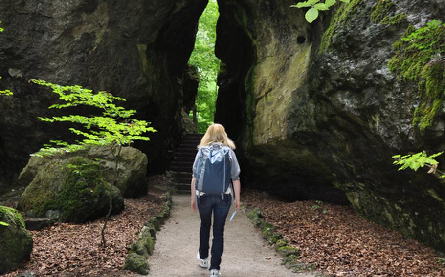 A visitor makes her way through the rock garden in Sanspareil, Germany. Built during the 16th and 18th centuries, the garden is across the street from Zwernitz Castle outside the Kulmbach suburb of Wonsees.