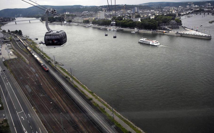 The "Deutsches Eck" (German Corner), where the Mosel River meets the Rhine River, is seen from an aerial cable car that links the Blumenhof courtyard with the Ehrenbreitstein fortress at this year&#39;s federal horticulture show in Koblenz.