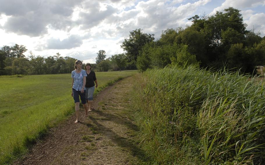 Hikers walk around the 3.5-kilometer loop at the barefoot park in Bad Sobernheim, Germany. The trail offers a variety of senses for hikers' feet, from mulch and grass to a rope bridge and clay-rich mud.