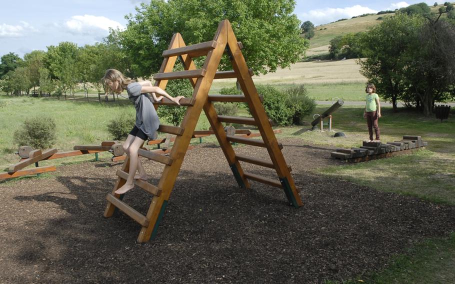 Balancing beams and various other foot stations,  such as this wooden ladder, are scattered throughout the barefoot trail.