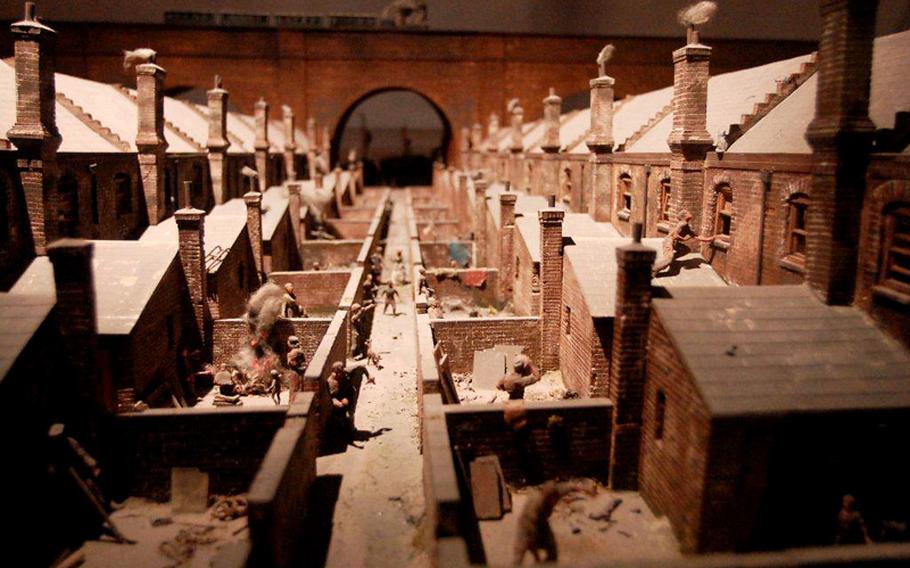 On permanent exhibit at the German Architecture Museum in Frankfurt, Germany, are a series of models showing the progression of dwellings through the ages, from huts to castles. This model conveys the conditions of workers in England in the 1870s, the scene taken from a drawing by the French illustrator Gustave Dore.