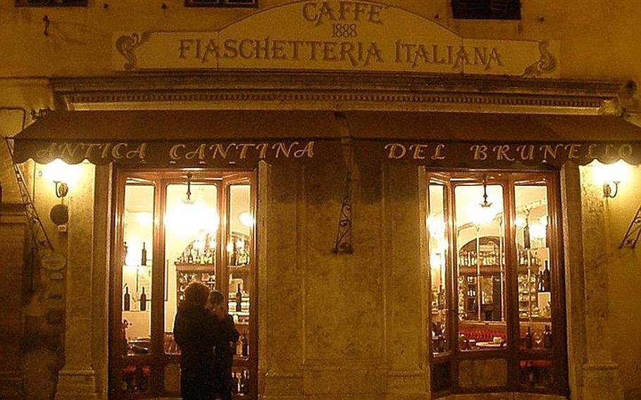 Patrons chat outside the famed Caffe Fiaschetteria Italiana 1888, a wine shop  decorated inside with red velvet sofas and yellow marble tables, originals from its opening 124 years ago.