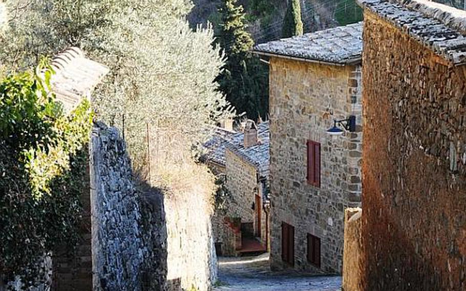 Narrow cobblestone roads and stone houses are customary throughout the Tuscan town of Montalcino.