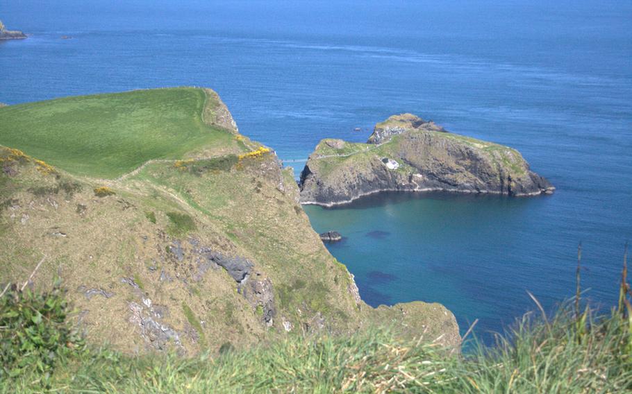 Looking out to the Atlantic, the small island of Carrick is connected to the mainland by the slender and wobbly Carrick-A-Rede Rope Bridge.