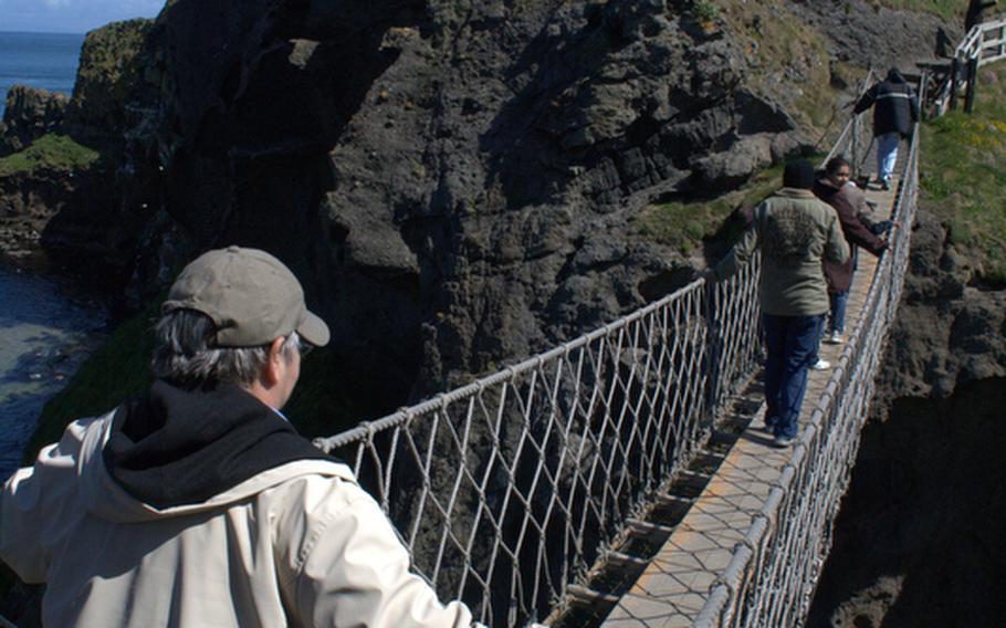 The swaying Carrick-A-Rede Rope Bridge, made of planks strung between wires, sits nearly 100 feet above the crashing waves of the Atlantic.