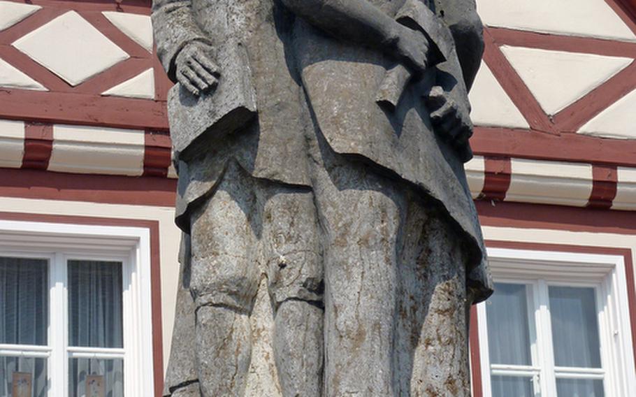 This statue tops a fountain in the center of Oettingen, Germany, and represents the burghers of the city.
