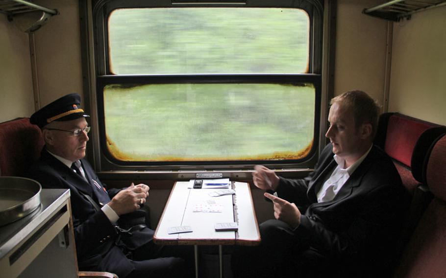 Train conductors play cards during the scenic three-hour train ride from Sarajevo to Mostar.