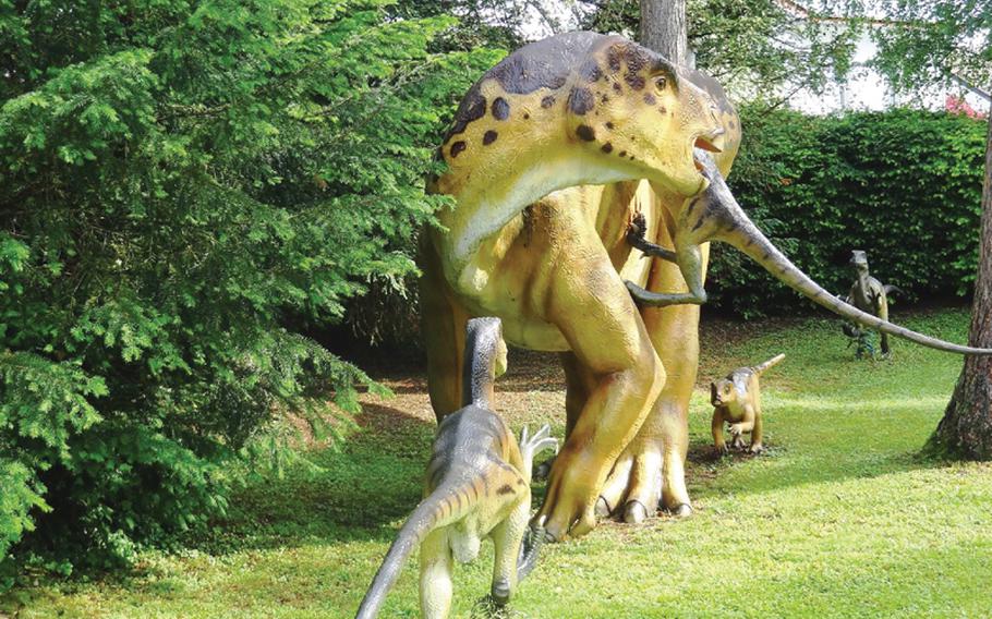 In the Dino Park, several Deinonychus dinosaurs, known for hunting in packs, are portrayed attacking a plant-eating Iguanodon. Both types of creatures lived in the Early Cretaceous period.  