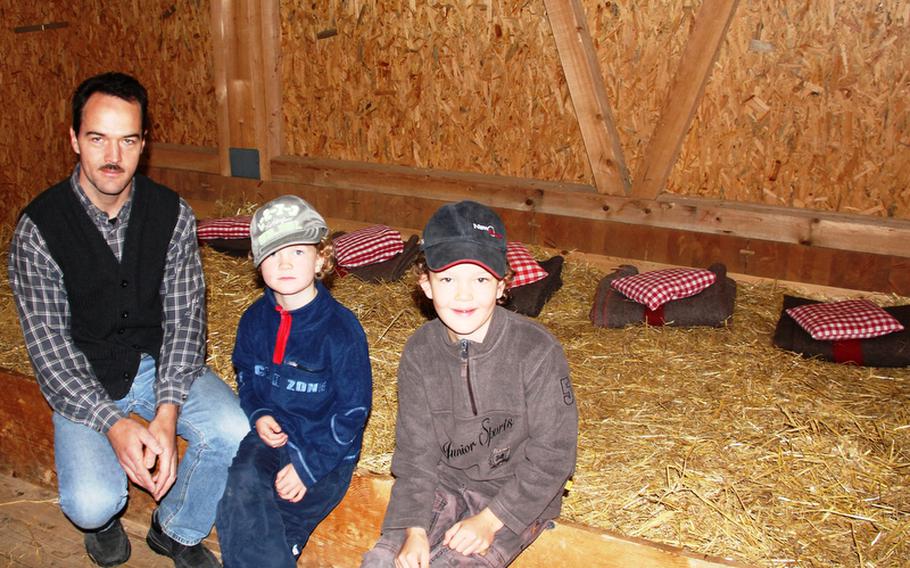Visitors can sleep in the straw at the Bauernhof Salwideli farm hotel. A pillow and blanket are furnished, but it's best to have a sleeping bag. These boys and their father are among those who recently enjoyed a night on the straw.