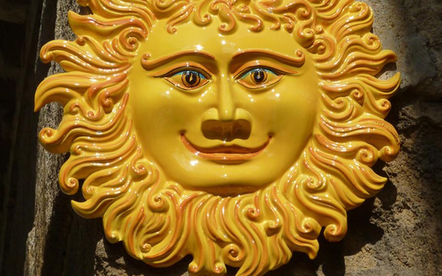 The Sicilian city of Caltagirone is famous for its ceramics, although you can probably find a happy sun like this one at most pottery shops on the island.