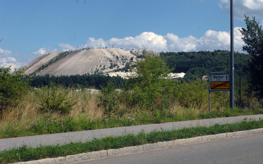 Monte Kaolino as seen from a distance. The roughly 400-foot tall sand hill is the result of decades of mining in Hirschau, Germany. Now an amusement park with swimming pools and a handbrake coaster, Monte Kaolino draws crowds of locals and Americans on summer days.
