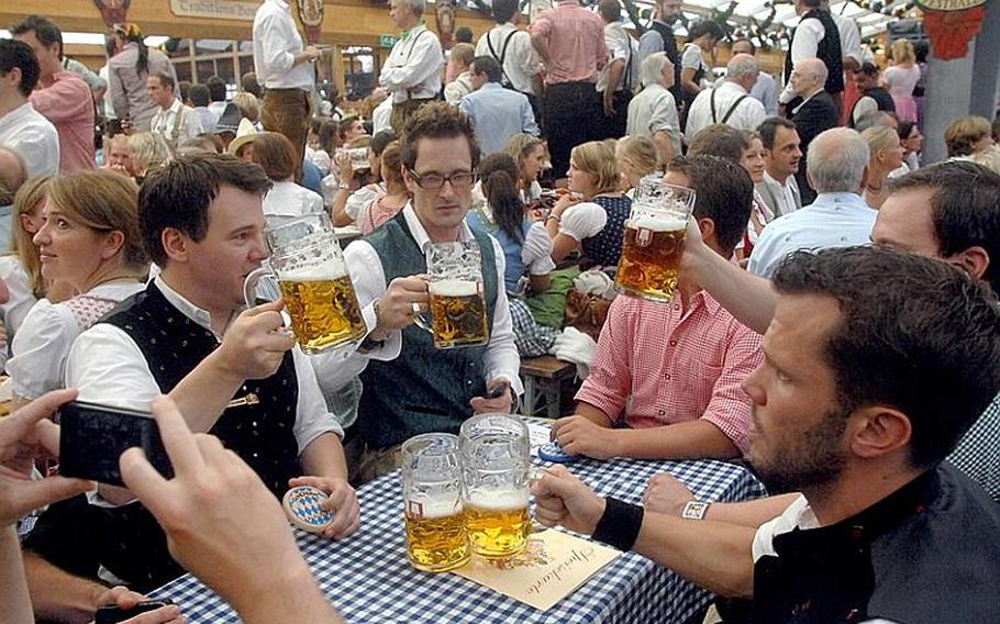The beer flows in the tents on opening day at Oktoberfest in Munich. The festival runs through Oct. 7.