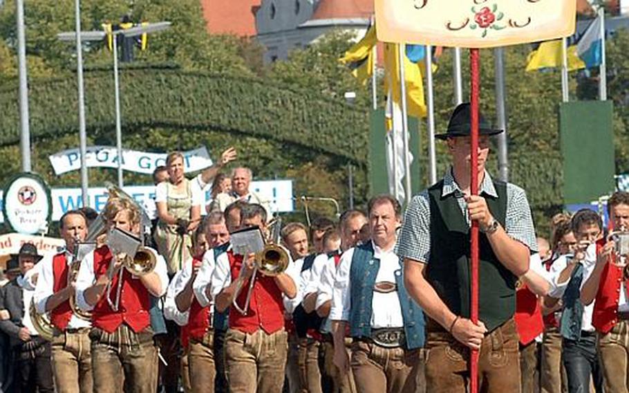 The Oktoberfest landlords (owners of the beer tents) and breweries parade into the grounds on opening day at Oktoberfest.  
