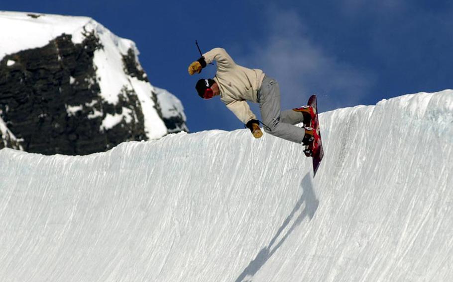 A snowboarder has fun on the half-pipe at Grindelwald, Switzerland. Switzerland takes top nation honors of world's "best countries," according to U.S. News & World Report, the University of Pennsylvania's Wharton School and global brand consultants BAV Consulting. 