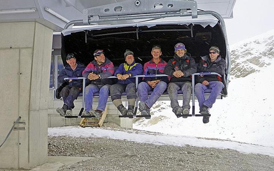 Workers try out the new Wetterwandeckbahn lift during construction on the Zugspitze mountain in Garmisch-Partenkirchen, Germany.