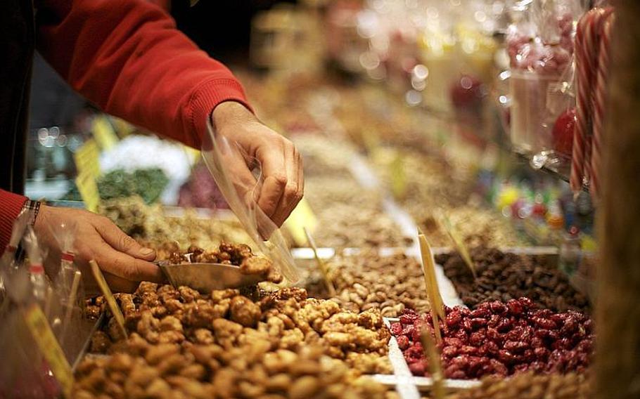 Candy and candied nuts add to the aromatic landscape at the market.