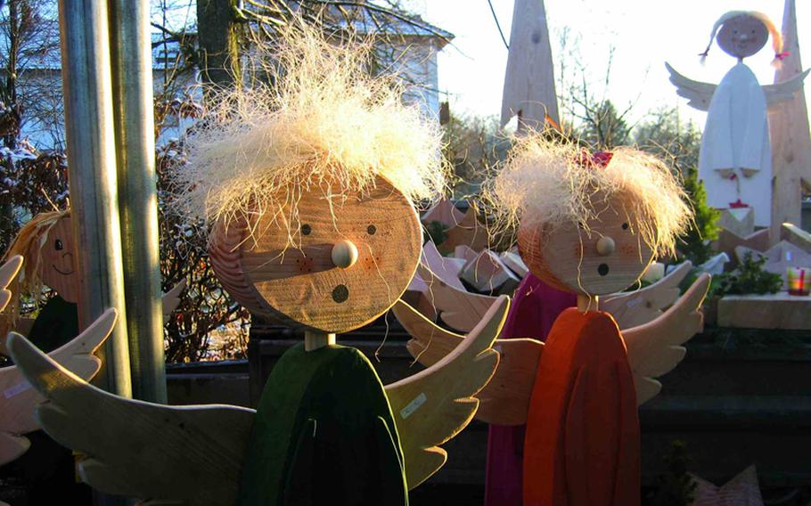 Artist Uwe Flockerzi sells handmade wooden angels such as these at the market. Vendors use products and byproducts of the surrounding forest to make their wares.