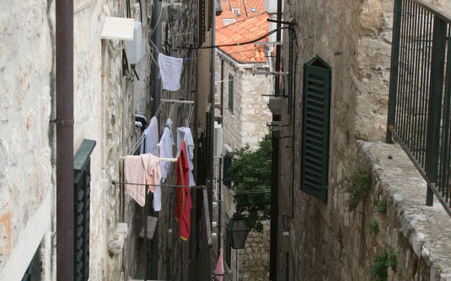 The alleyways and plazas south of Stradum climb toward the famous city walls of Dubrovnik.