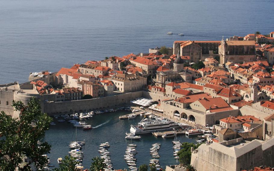 On the Adriatic coast, Dubrovnik's old town is wrapped by its famous ramparts, which visitors can walk for beautiful views of the sea and the old town.