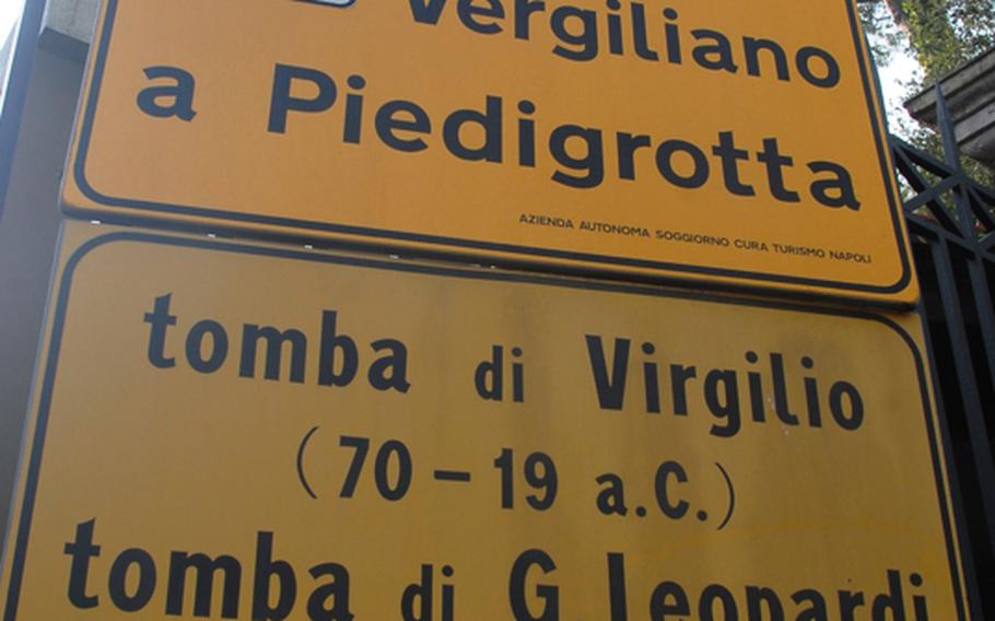 Sign at the entrance to Parco Vergiliano a Piedigrotta in downtown Naples, Italy, noting the park contains the tombs of poets Virgil and Leopardi.