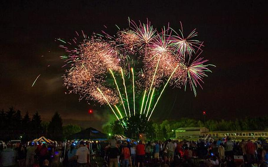 Community members of the United States Army Garrison Stuttgart military community gather on Patch Barracks athletic field for the 2012 July 4th celebration and fireworks. This year's celebration will be held on July 3 in order to avoid holiday pay for officials who work during the celebration. 