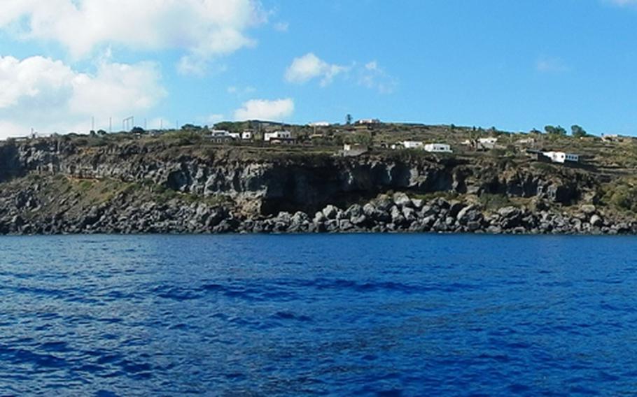 Unspoiled crystal clear blue-green sea waters beckon visitors to the windswept volcanic Italian island of Pantelleria.