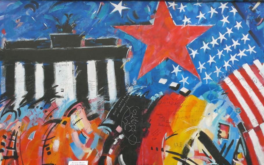 A work by Peter Lorenz on Berlin’s East Side Gallery depicts the Brandenburg Gate, the American flag and the Soviet red star. The remnant of the Berlin Wall is considered the world’s largest open-air gallery.