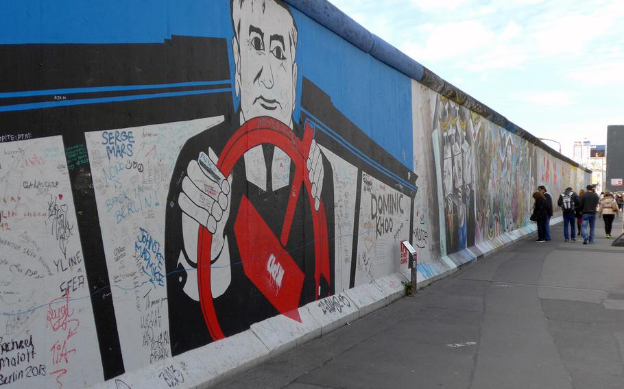 A mural by Georg Lutz depicts former Soviet leader Mikhail Gorbachev driving. Although Ronald Reagan famously called for him to tear down the wall, some give Gorbachev partial credit for its peaceful destruction because he did not send in Warsaw Pact troops to stop it.