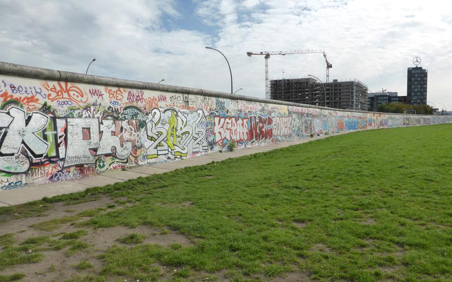 The western side of the Berlin Wall at the East Side Gallery, which has more than 100 original murals decorating it.
