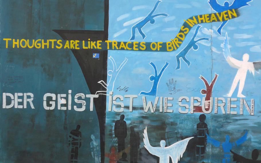 A close up of Ingeborg Blumenthal's mural "Thoughts are Like Traces of Birds in Heaven" at the East Side Gallery in Berlin, Germany.
