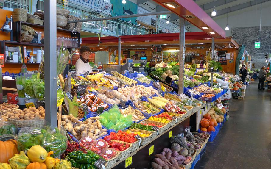 Baskets full of vegetables are on sale at the Kleinmarkthalle in Frankfurt, Germany. Fruit, vegetables, meat, spices, nuts, dried fruits and much more can be bought at the indoor food market, making it a gourmand's paradise.