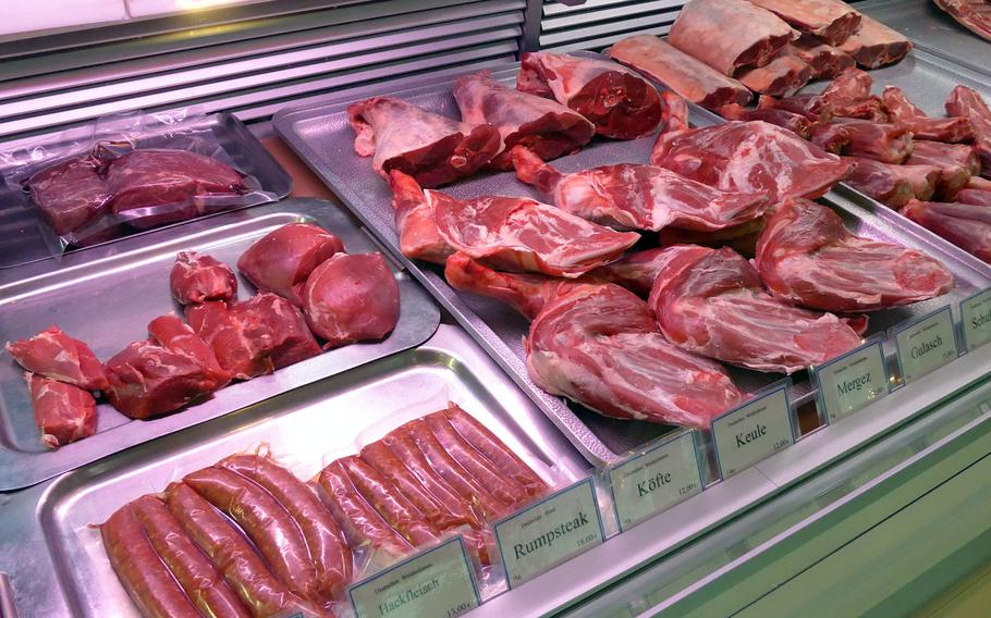 A butcher's stand showcases various types of beef and lamb at the Kleinmarkthalle in Frankfurt, Germany.