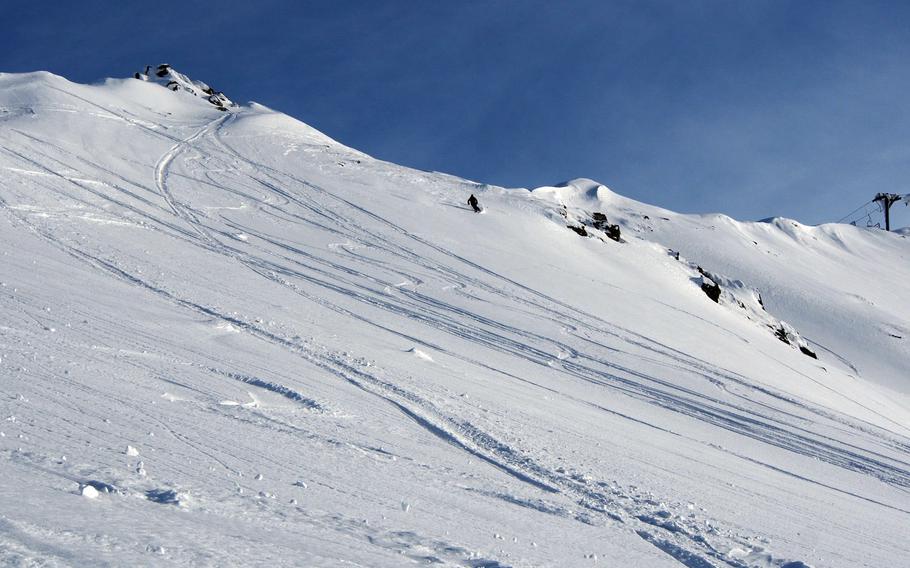 A lone skier begins his descent from Brezovica, Kosovo, where the lifts are dormant.