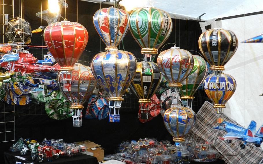 Colorful tree ornaments made out of recycled aluminum cans were among the decorations sold at the Christmas market in Lincoln, England, in 2012.