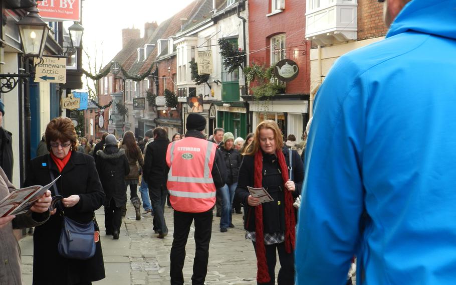 Outside of the market's boundaries, pedestrians forget the one-way-only rule and stroll Lincoln's quaint old town streets. Many of the shops were open on Sunday.