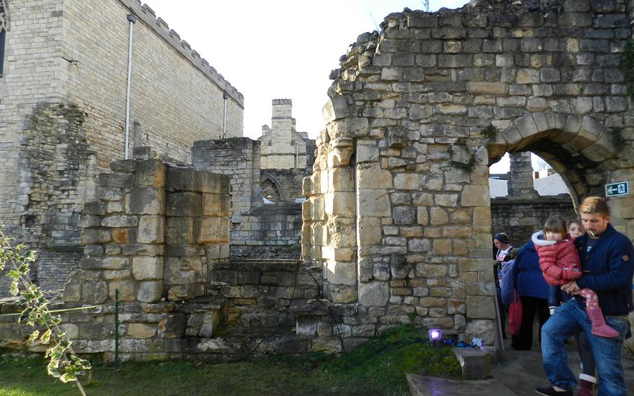 It's best to wear sturdy walking shoes if you're going to the medieval market at Lincoln, England. The medieval market is small, but is held among ruins.