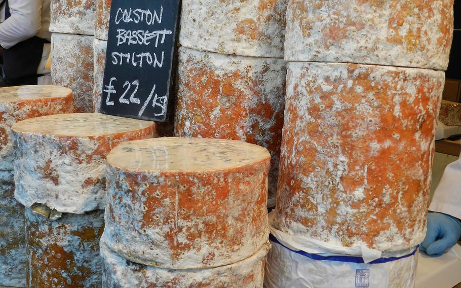 Mounds of cheese tempt visitors to the Lincoln, England, Christmas market.