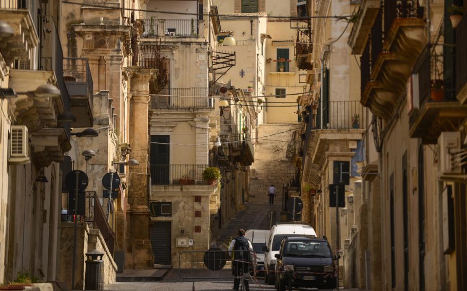 A typical street scene in Noto, Sicily, displaying Baroque architecture.